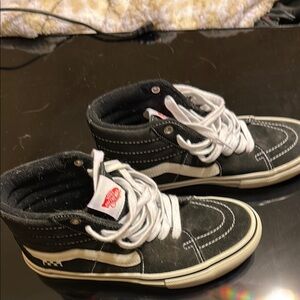 Vans Mens/Womens.  Black and White High-Top Sneakers